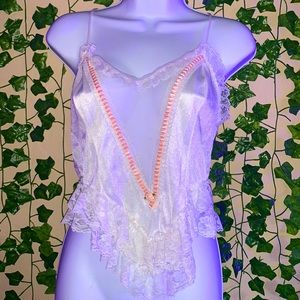 top with detailed pink ruffles and flower